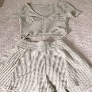 This outfit is a set with a matching crop top the top and bottom are both XS